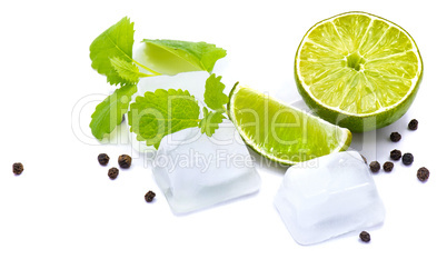 Fresh lime and melissa isolated on white