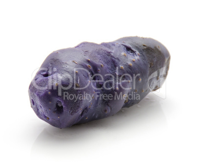 Fresh vitelotte potato isolated on white