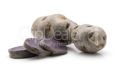 Fresh vitelotte potato isolated on white