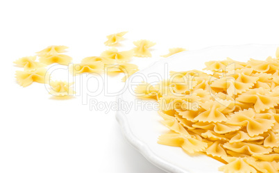 Raw fresh farfalle isolated on white