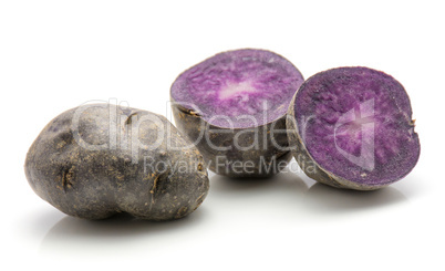 Fresh vitelotte potato isolated on white