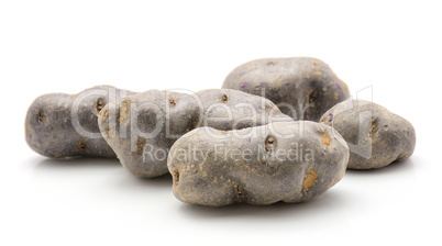 Fresh vitelotte potato isolated on white