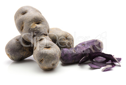 Fresh vitelotte potato isolated on white