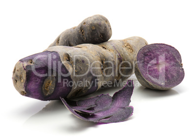 Fresh vitelotte potato isolated on white