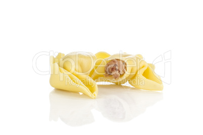 Fresh Raw tortellini pasta isolated on white