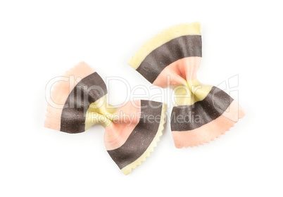 Colourful raw farfalle isolated on white