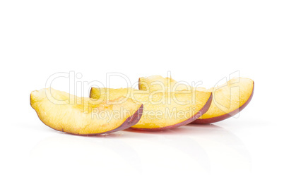 Fresh Raw vibrant plums isolated on white