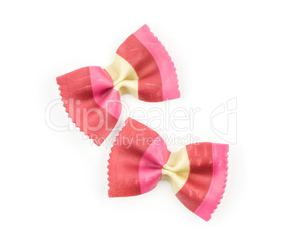 Colourful raw farfalle isolated on white