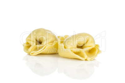 Fresh Raw tortellini pasta isolated on white