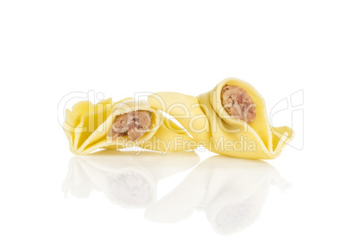 Fresh Raw tortellini pasta isolated on white