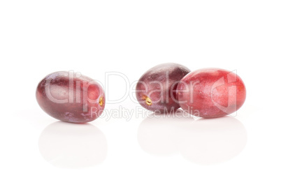 Raw fresh red globe grape isolated on white