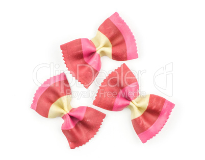 Colourful raw farfalle isolated on white