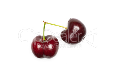 Fresh raw sweet red cherry isolated on white