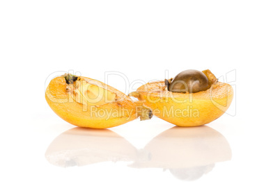 Fresh raw orange japanese loquat isolated on white