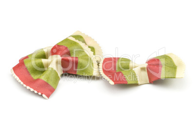 Colourful raw farfalle isolated on white