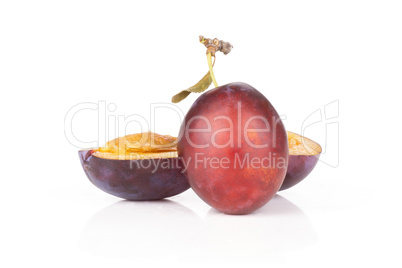 Fresh Raw vibrant plums isolated on white