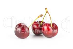 Fresh raw sweet red cherry isolated on white