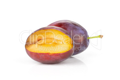 Fresh Raw vibrant plums isolated on white