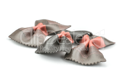 Colourful raw farfalle isolated on white