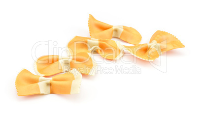 Colourful raw farfalle isolated on white