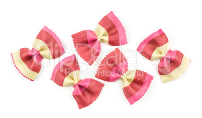 Colourful raw farfalle isolated on white