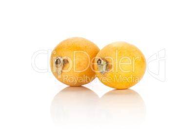 Fresh raw orange japanese loquat isolated on white