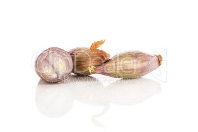 Fresh raw long shallot onion isolated on white