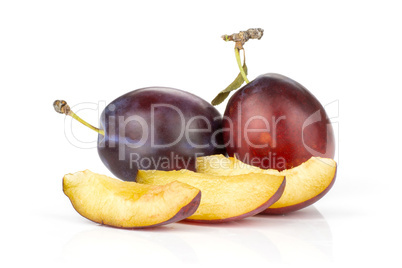 Fresh Raw vibrant plums isolated on white