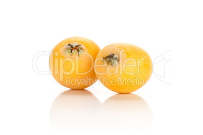 Fresh raw orange japanese loquat isolated on white