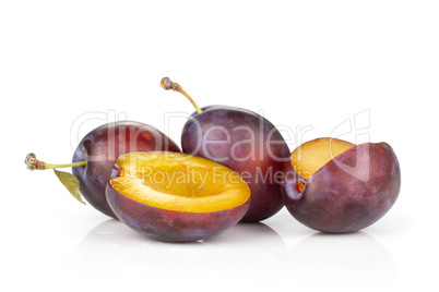 Fresh Raw vibrant plums isolated on white