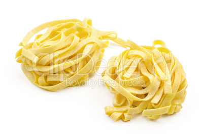 Raw fresh Fettuccine isolated on white