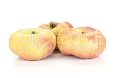 Fresh raw saturn peach isolated on white