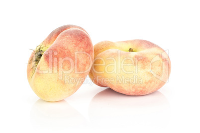 Fresh raw saturn peach isolated on white