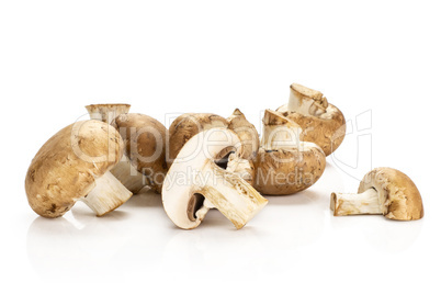 Fresh raw brown champignons isolated on white