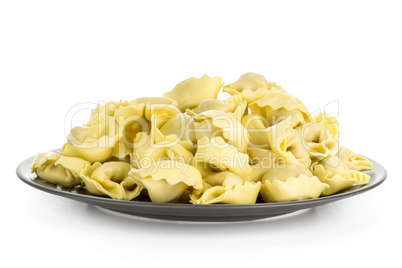 Fresh Raw tortellini pasta isolated on white