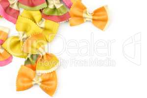 Colourful raw farfalle isolated on white