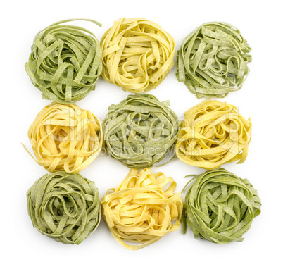 Raw fresh Fettuccine isolated on white