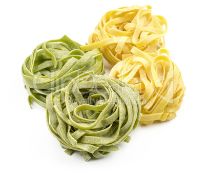 Raw fresh Fettuccine isolated on white