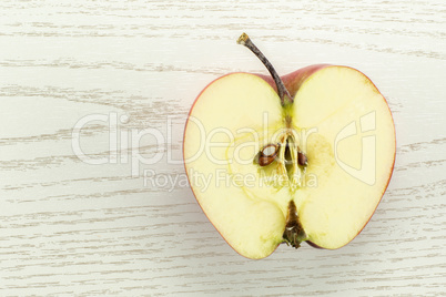 Fresh raw apple red delicious on grey wood