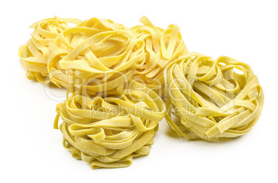 Raw fresh Fettuccine isolated on white