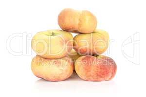 Fresh raw saturn peach isolated on white