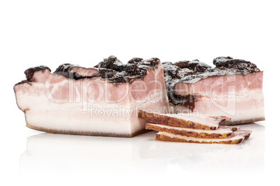 Fresh smoked english bacon isolated on white