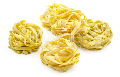 Raw fresh Fettuccine isolated on white