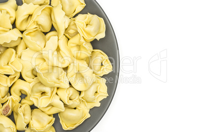 Fresh Raw tortellini pasta isolated on white