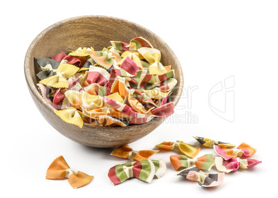 Colourful raw farfalle isolated on white