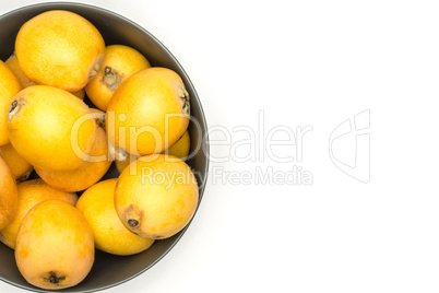 Fresh raw orange japanese loquat isolated on white