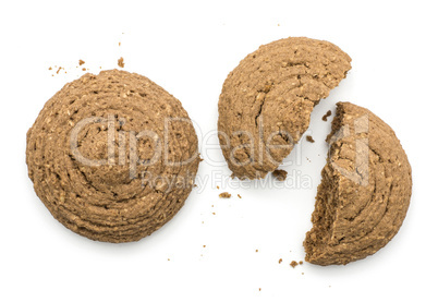 Two cocoa oat cookie top view one cracked isolated on white back