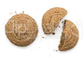 Two cocoa oat cookie top view one cracked isolated on white back