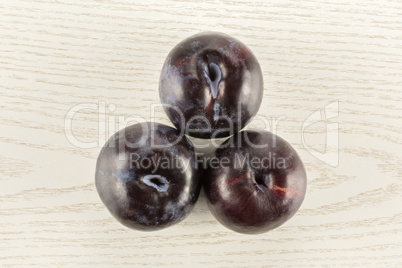 Red Blue Plums on grey wood