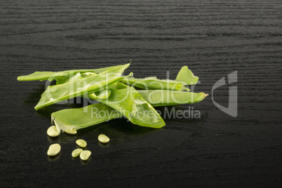 Fresh Flat Green Bean on black wood